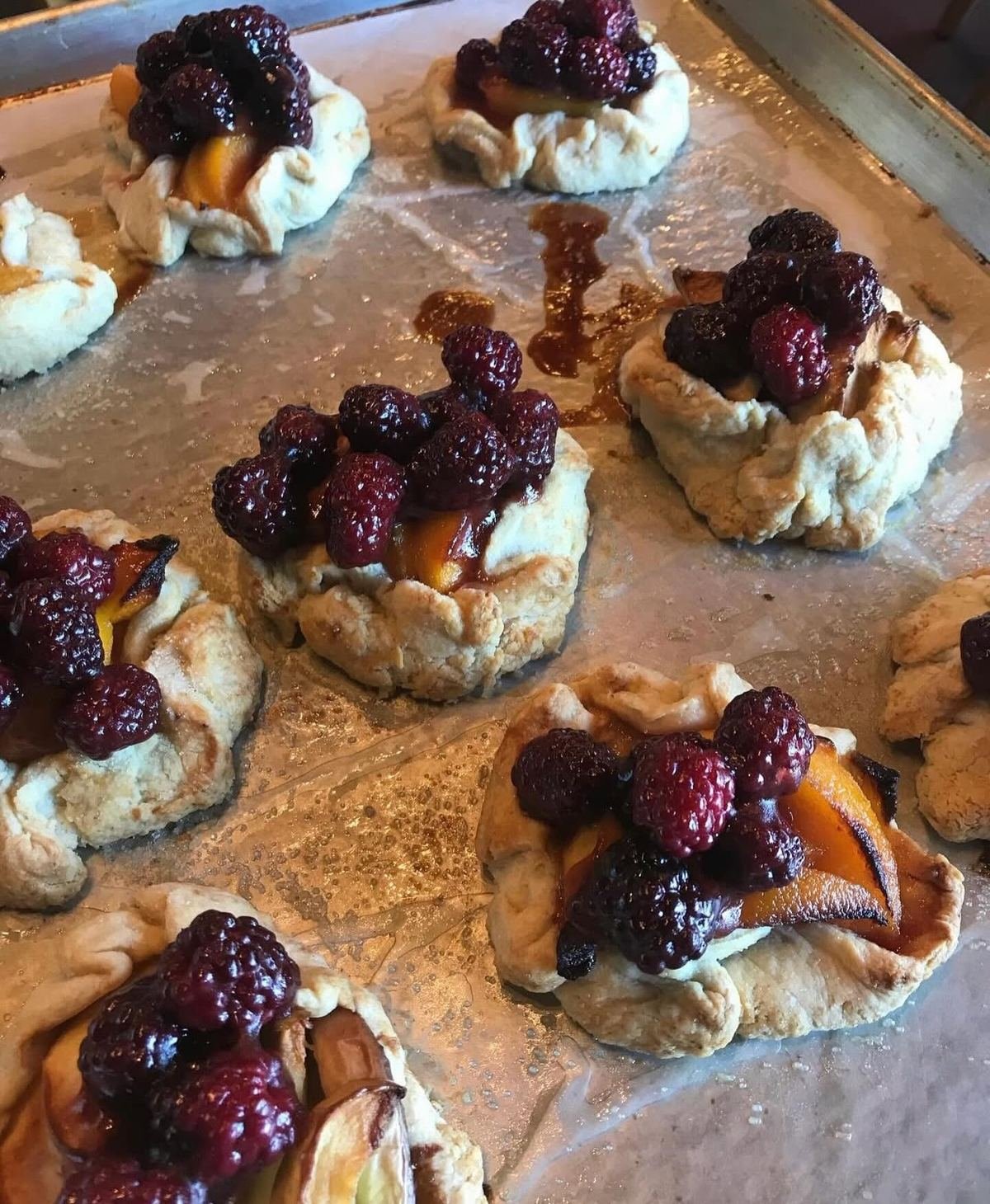 Berry and peach galettes on the tray